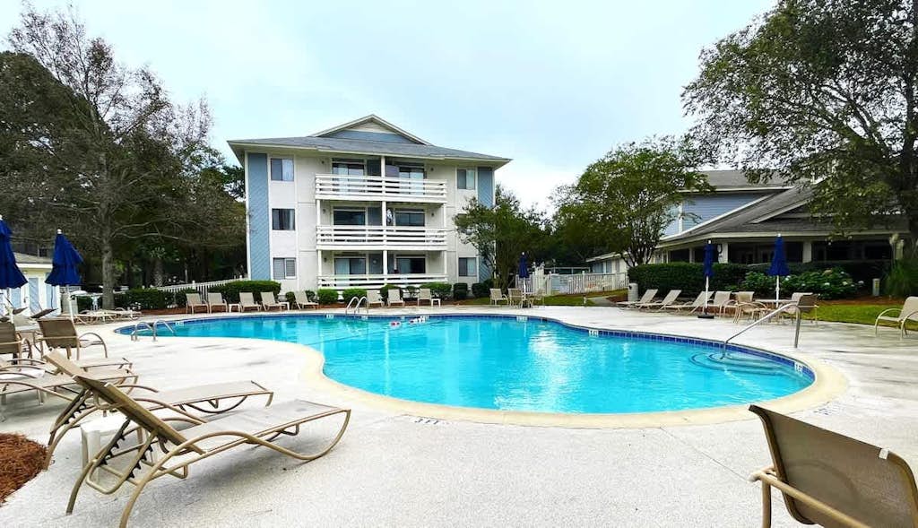 Experience the ultimate Hilton Head getaway in this newly renovated 2BR/2BA villa. Located in the gated Fiddler's Cove, you are just a short walk from the pristine sands of Folly Field Beach. Enjoy a modern kitchen with quartz countertops, brand-new stainless steel appliances, and a primary suite featuring a luxurious rain shower. On-site amenities include two large pools, a hot tub, tennis, and pickleball courts. Perfect for families looking for comfort, security, and coastal charm.
