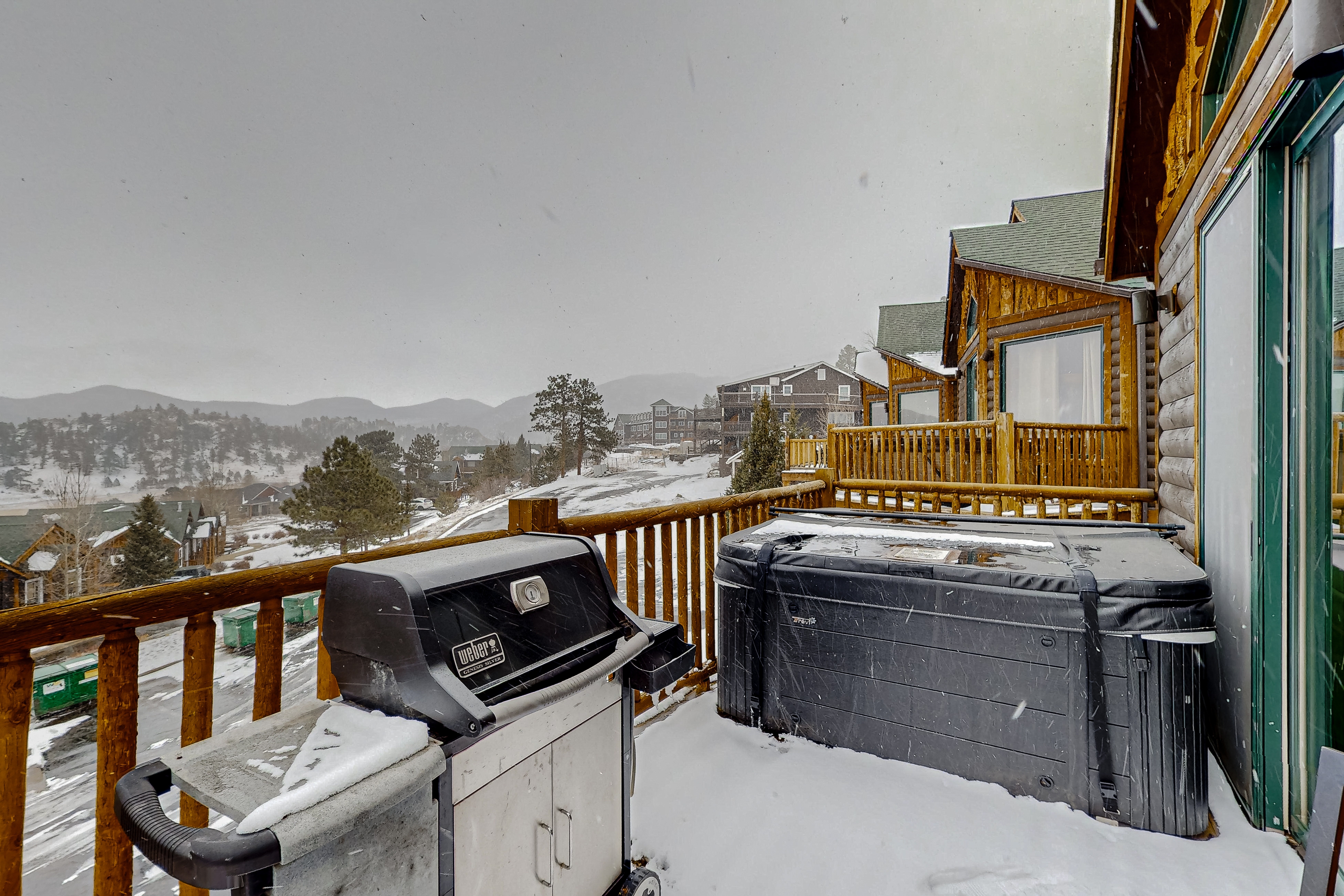 Mountain-view condo with private hot tub, balcony, pool, fireplace, streaming