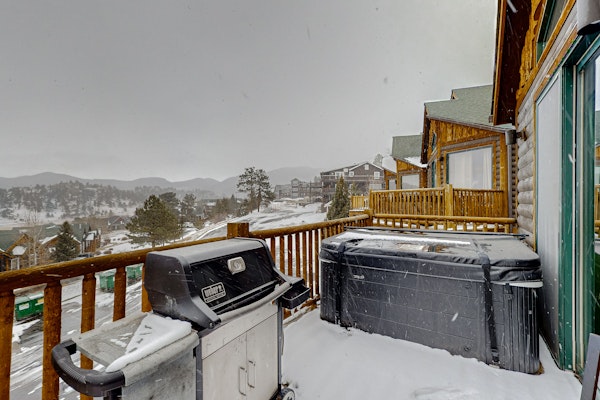 Mountain-view condo with private hot tub, balcony, pool, fireplace, streaming