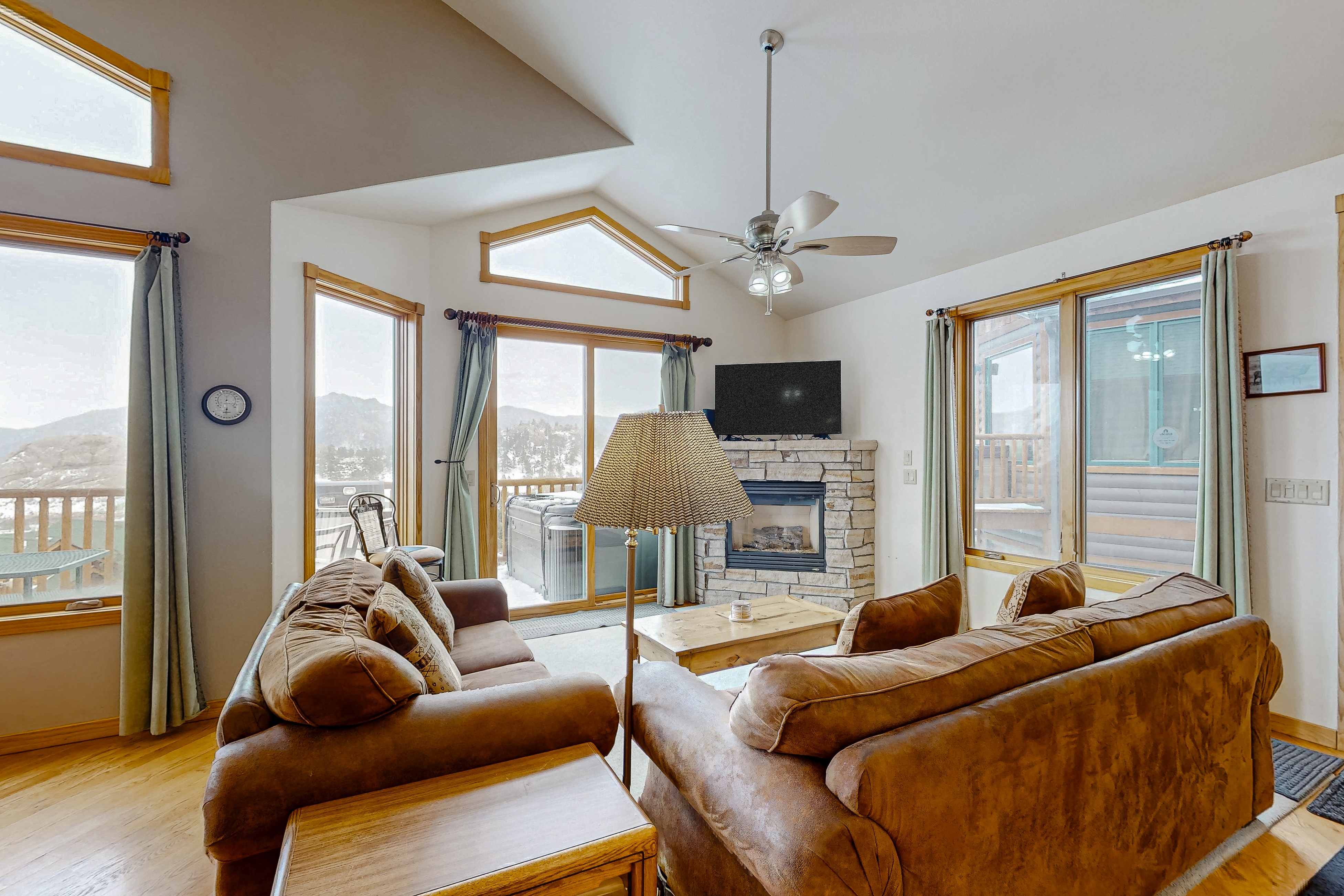 Mountain-view condo with private hot tub, balcony, pool, fireplace, streaming