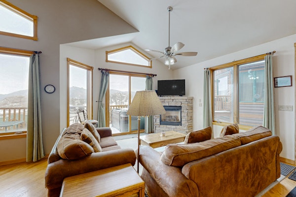 Mountain-view condo with private hot tub, balcony, pool, fireplace, streaming