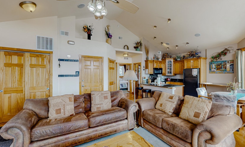 Mountain-view condo with private hot tub, balcony, pool, fireplace, streaming