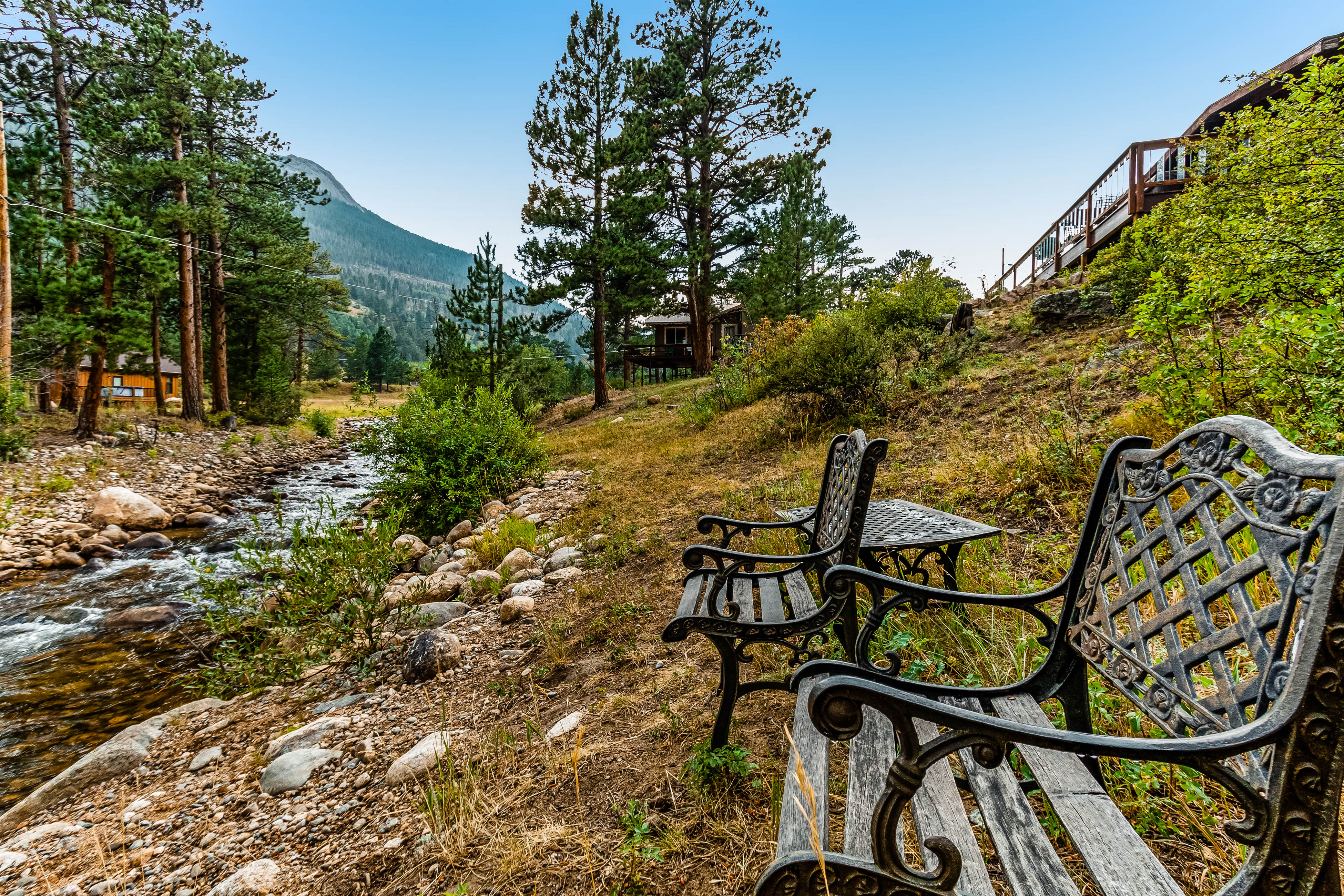Hot Tub, Pool Table, and Dog Friendly! RIVER WATERFRONT cabin with mountain views