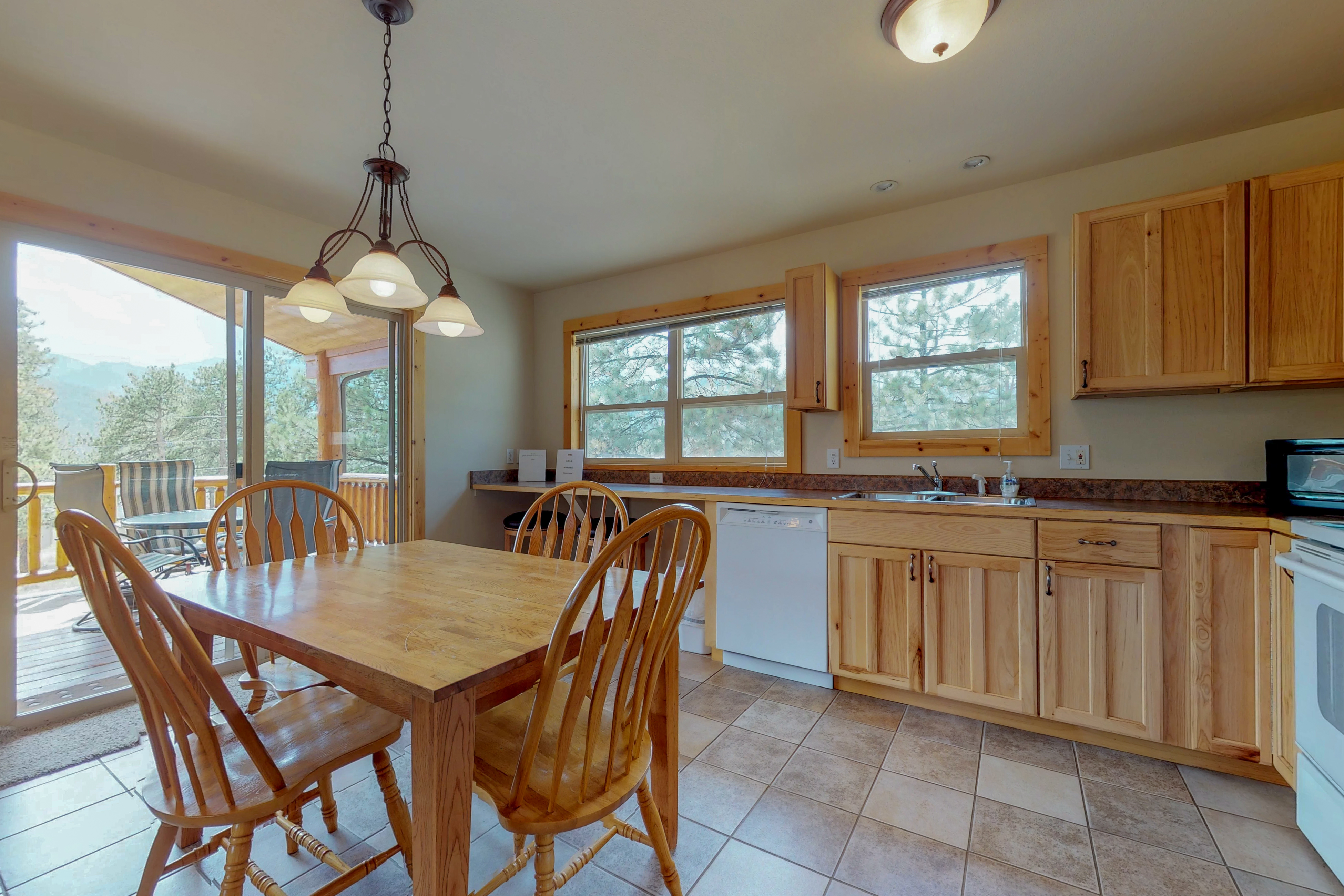 Wonderful location with full kitchen, furnished deck & mountain views
