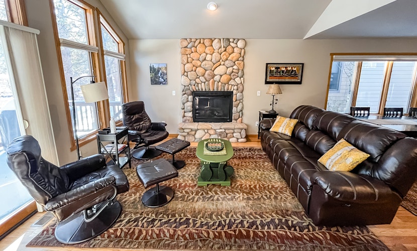 Waterfront townhome with private deck, fireplace, walking trail, & river access