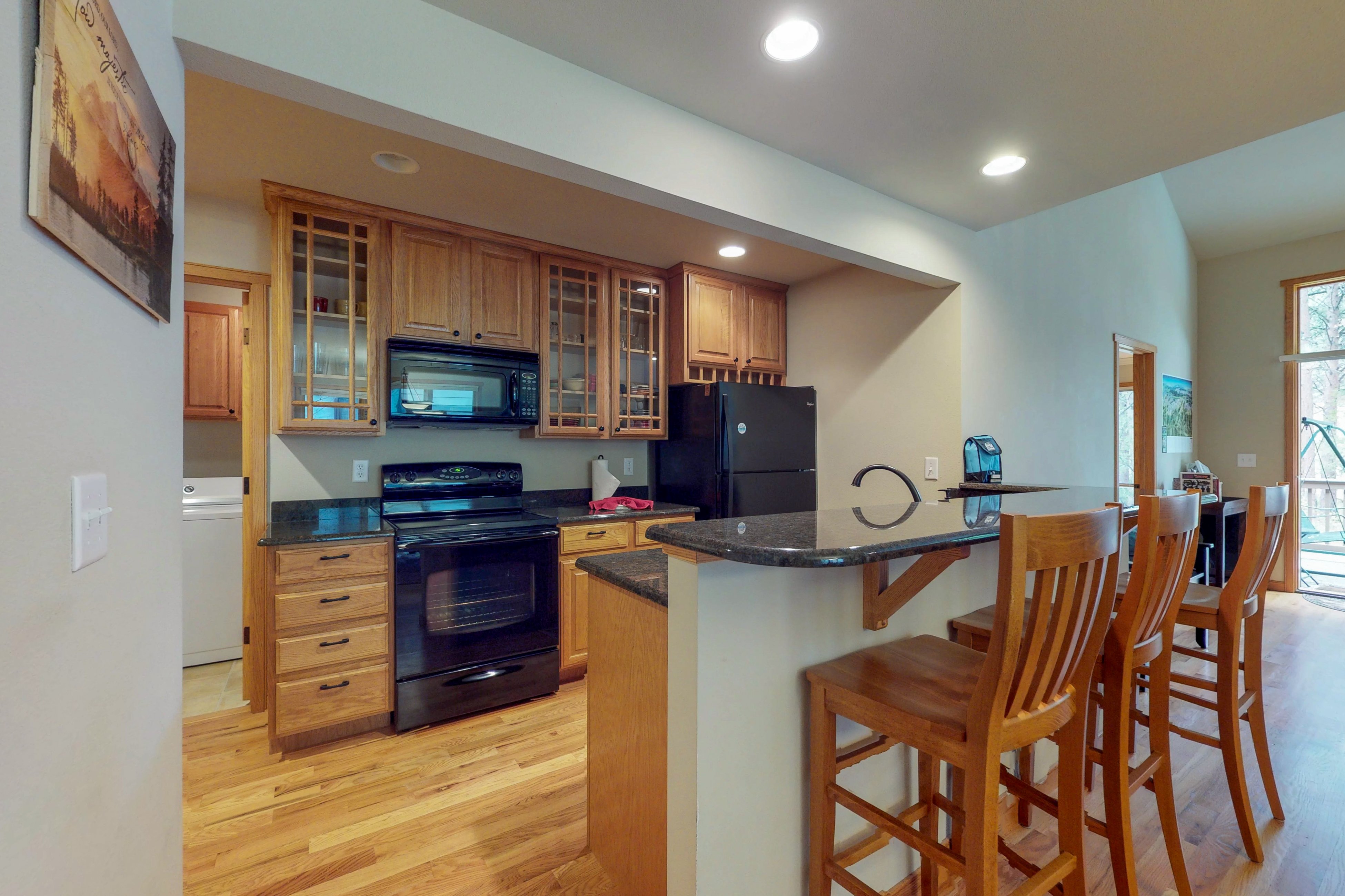 Waterfront townhome with private deck, fireplace, walking trail, & river access