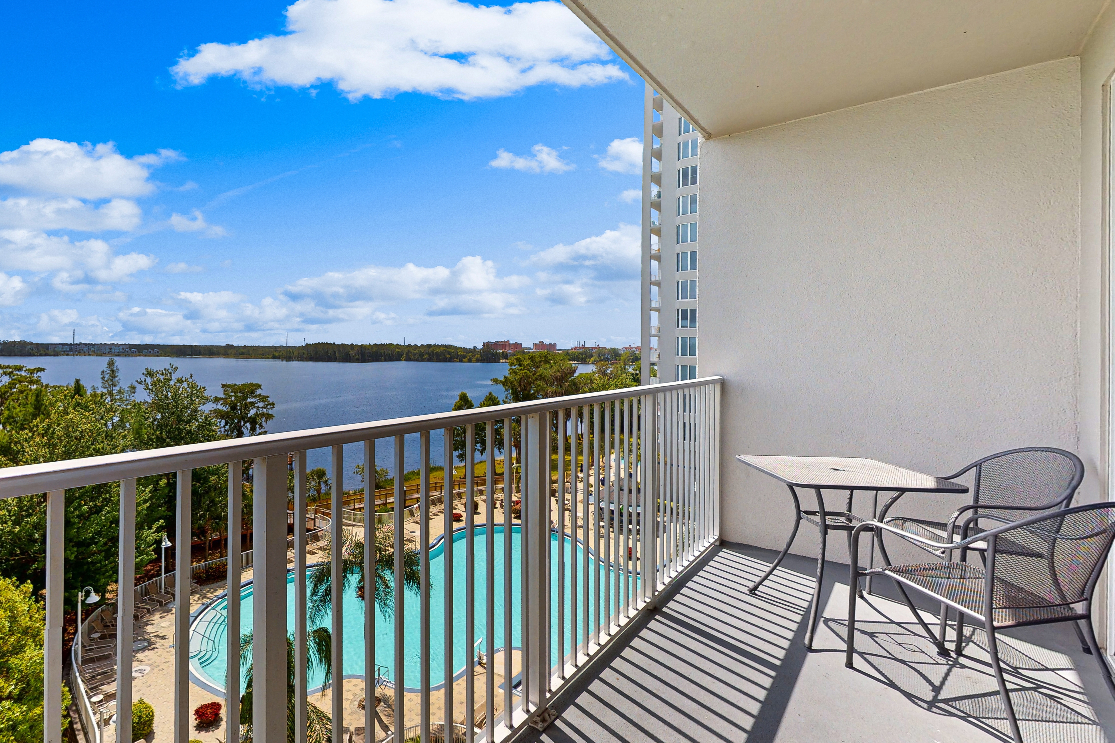 Lakefront condo with amazing views, pool, & hot tub - steps from the beach