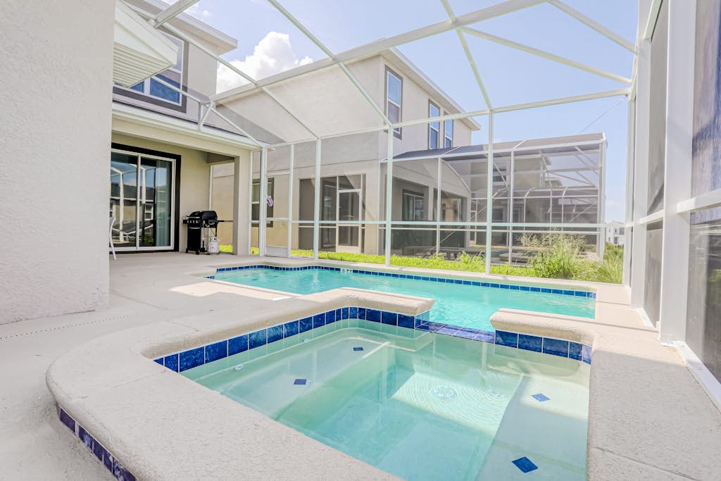 All-new, charming home with screened pool with spa, game room, & foosball