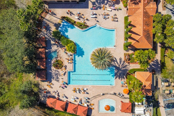 Enchanting condo with pool, hot tub, fitness area, balcony, & washer/dryer