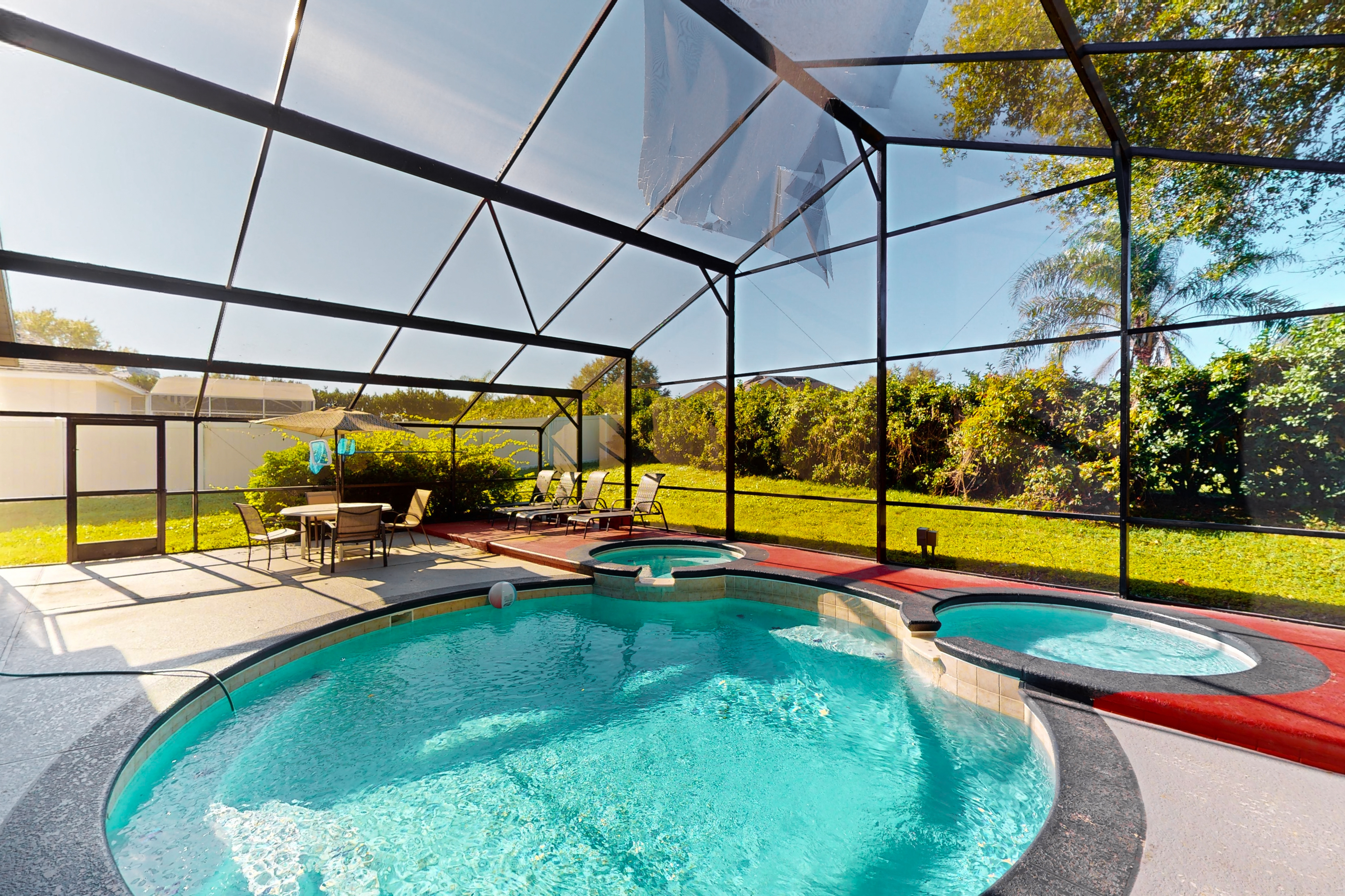 Spacious home with game room and mickey shaped pool and gas grill