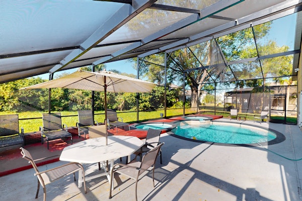 Spacious home with game room and mickey shaped pool and gas grill