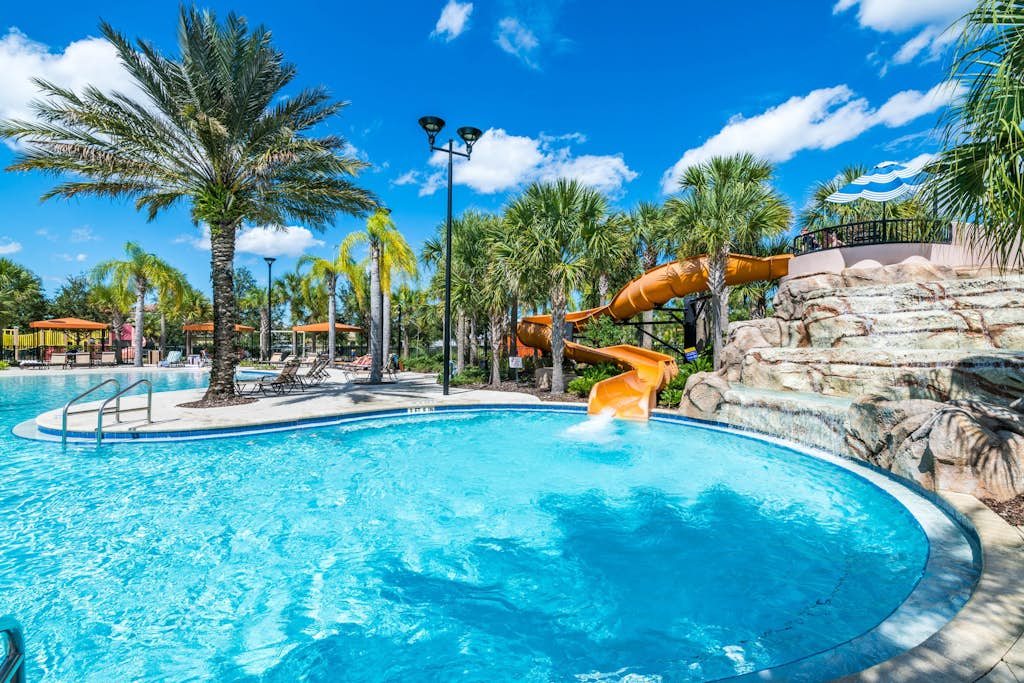 Gated-entry townhome with private pool, patio, game room, AC, & W/D