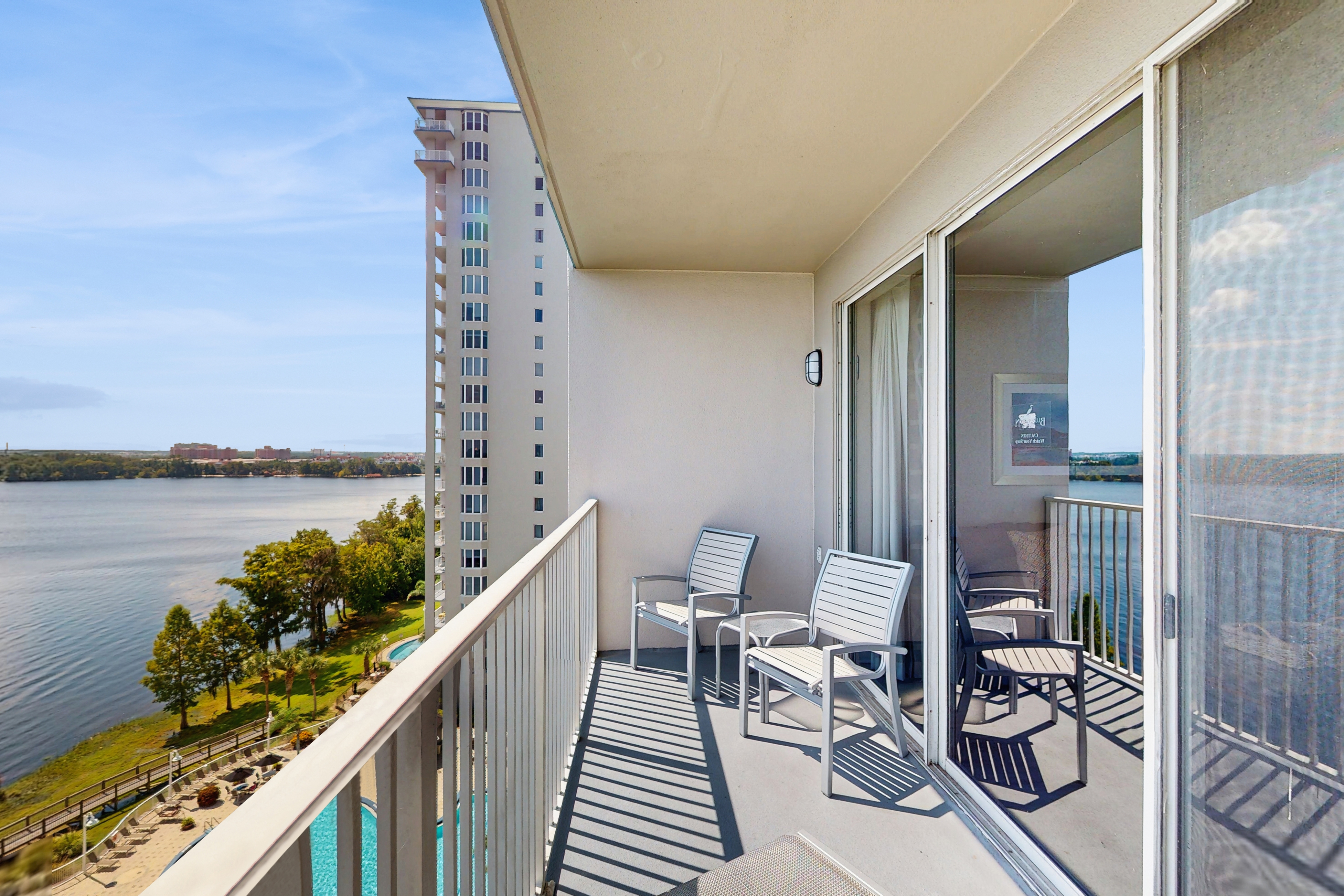 Unwind in a lakefront condo with AC, pool, hot tub & fitness center close to fun