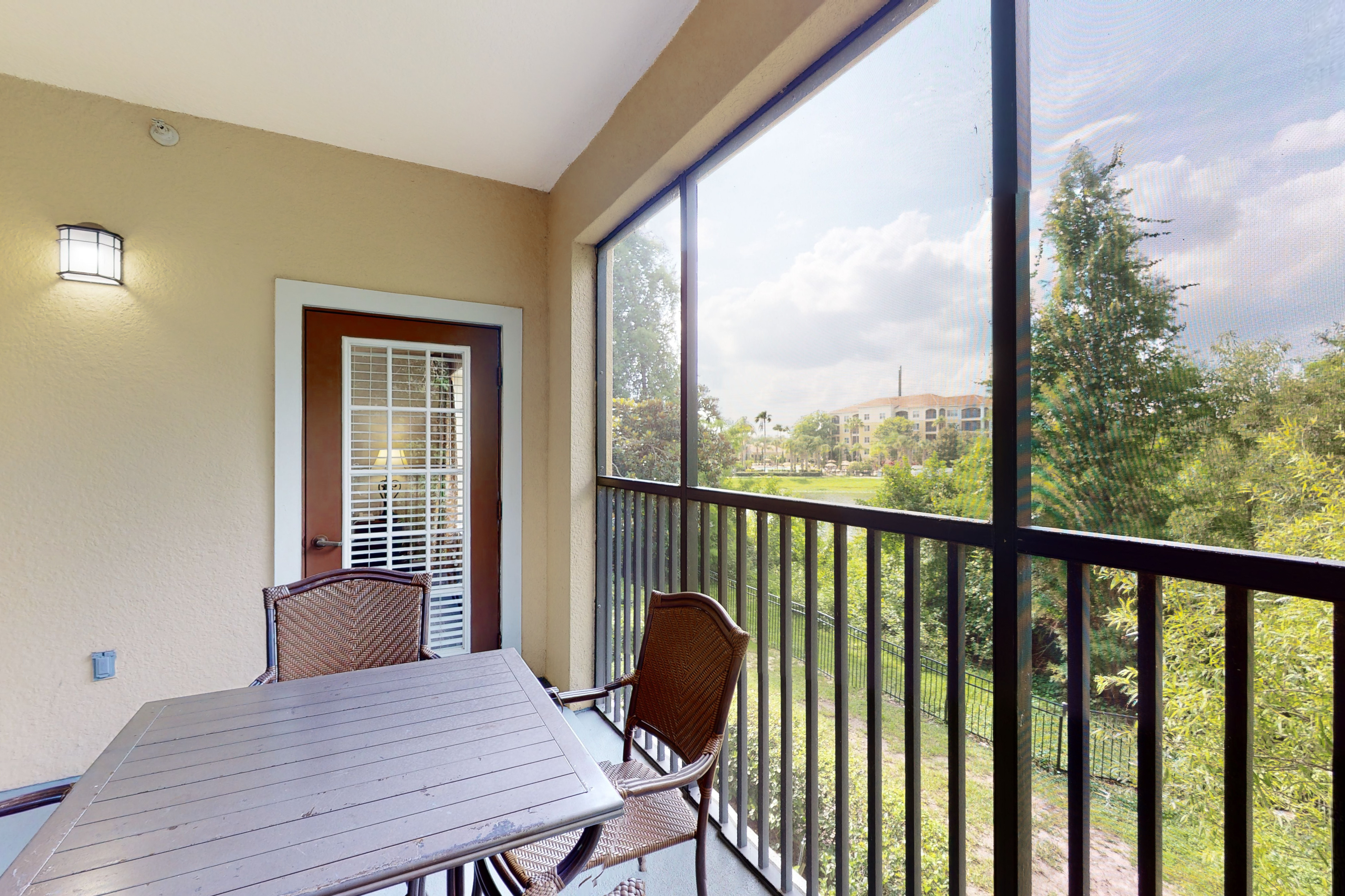 Inviting 4th-floor condo with elevator, screened balcony, washer/dryer & AC