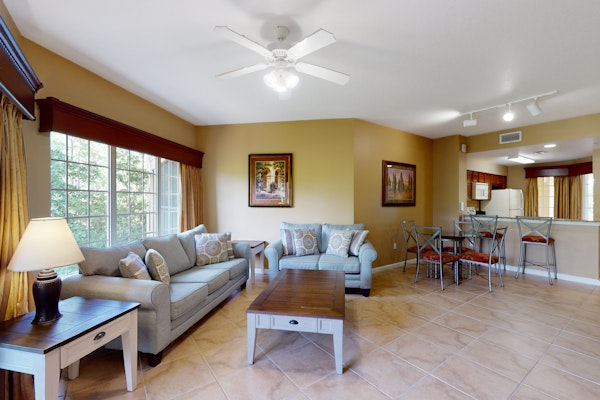 Inviting 4th-floor condo with elevator, screened balcony, washer/dryer & AC