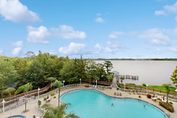 Lake-view 3rd-floor condo with hot tub, pools, balcony, shuttle service, & gyms