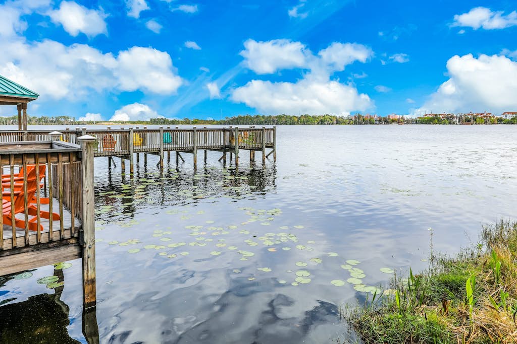 Lake-view 3rd-floor condo with hot tub, pools, balcony, shuttle service, & gyms