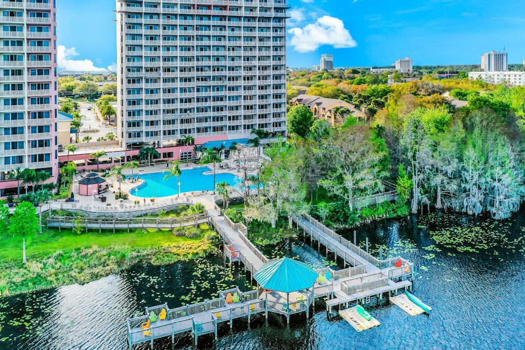 Lake-view 3rd-floor condo with hot tub, pools, balcony, shuttle service, & gyms