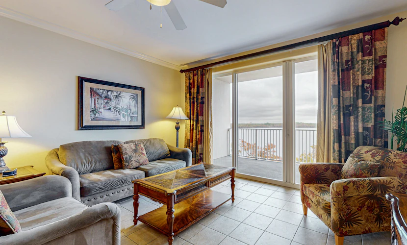 Relaxing lakefront condo near attractions with AC, hot tub, pool & lake view