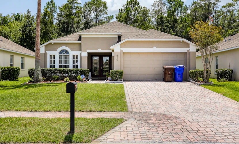 Stylish retreat with a private, heated pool, central AC, & garage game room