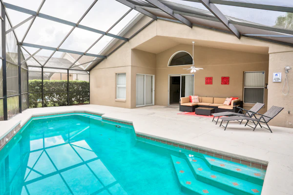 Stylish retreat with a private, heated pool, central AC, & garage game room