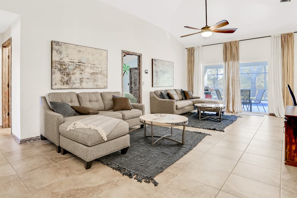 Peaceful home with an enclosed patio, pool, grill, washer/dryer, & AC