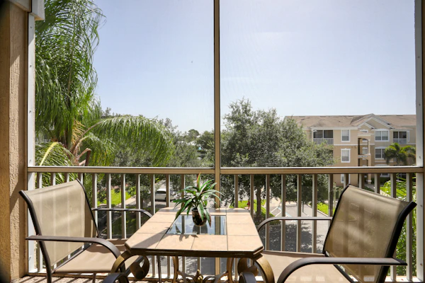 Resort condo with pools, hot tub, game room, tennis, gym, balcony, AC, & W/D