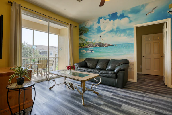 Resort condo with pools, hot tub, game room, tennis, gym, balcony, AC, & W/D