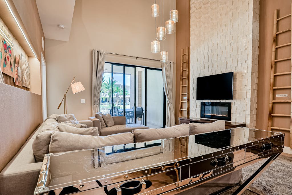 Modern villa with patio, grill, central AC, WiFi, shared pool, tennis, & gym