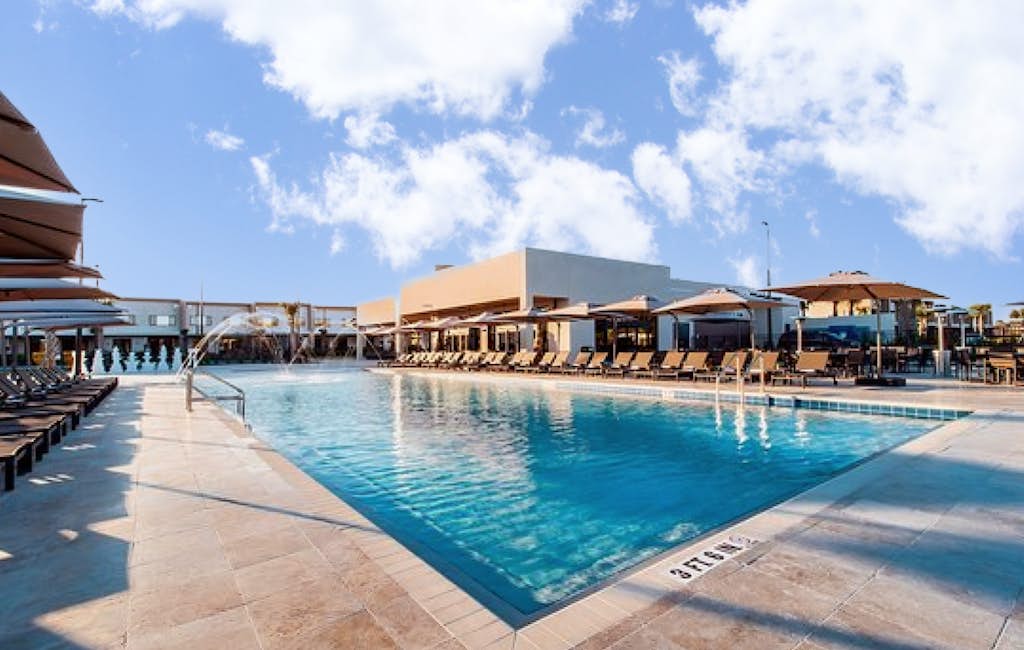 Modern villa with patio, grill, central AC, WiFi, shared pool, tennis, & gym