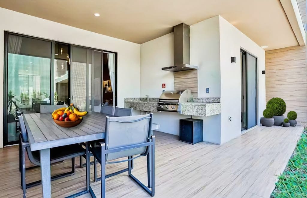 Modern villa with patio, grill, central AC, WiFi, shared pool, tennis, & gym