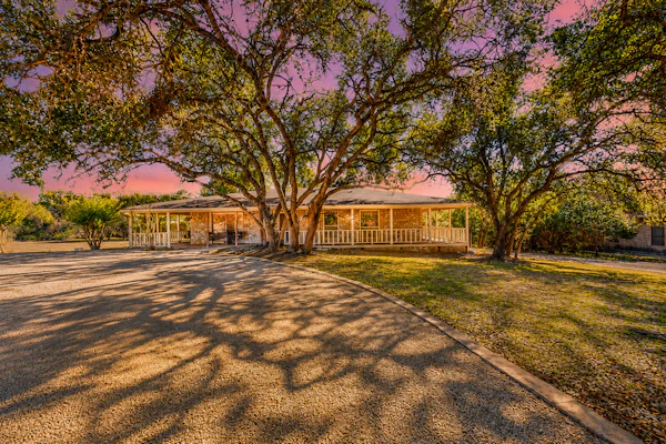 Spacious dog-friendly home settled on a serene property with wrap-around porch