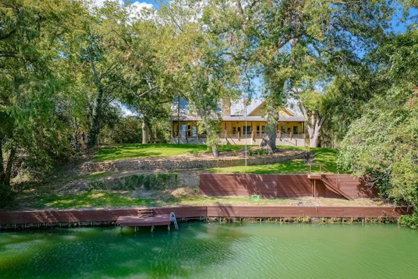 Riverfront home on Lake Seguin with dock, kayaks, beautiful views & air hockey
