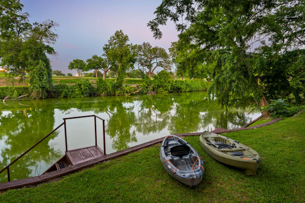 Riverfront home on Lake Seguin with dock, kayaks, beautiful views & air hockey