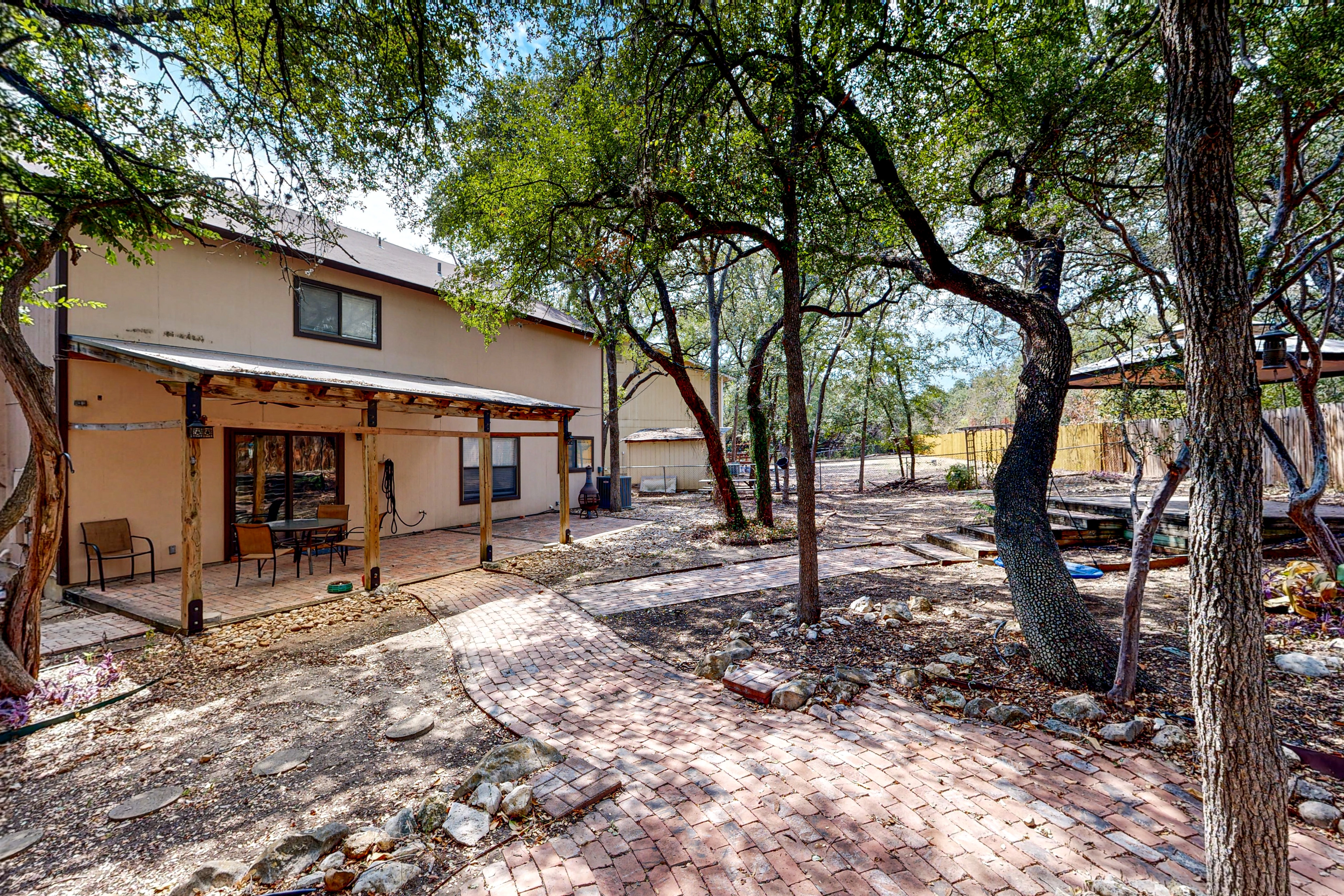 Dog-friendly home with huge yard, covered patio, & fireplace