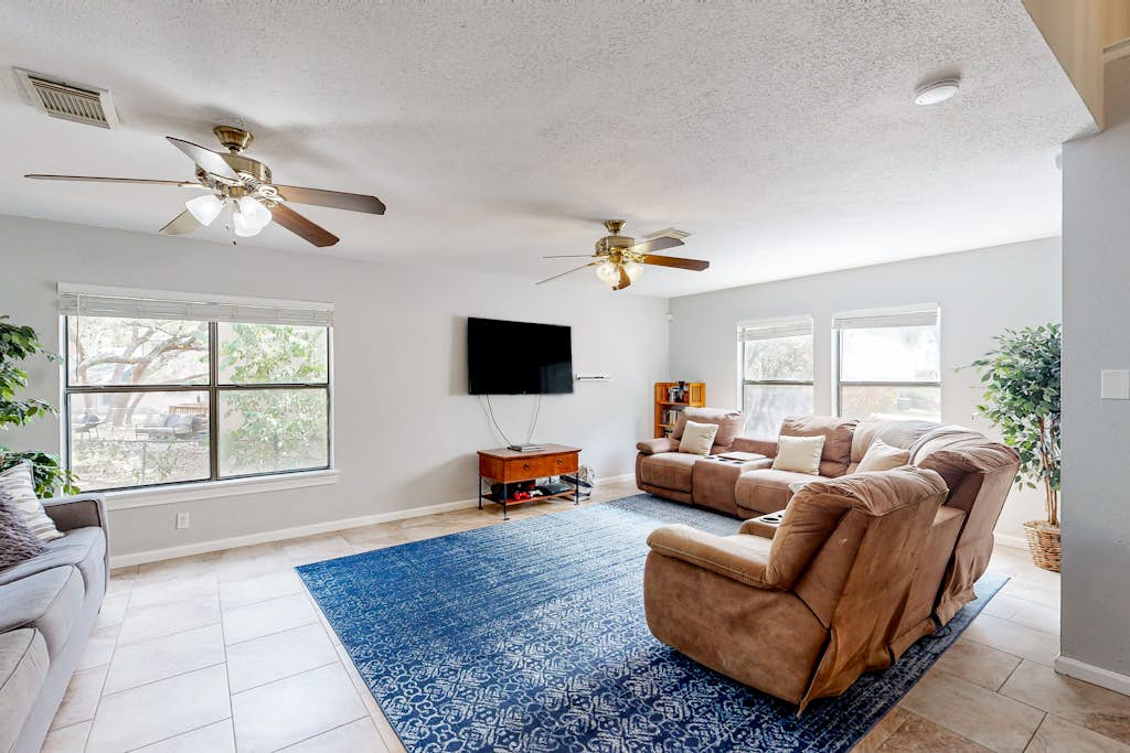 Dog-friendly home with huge yard, covered patio, & fireplace