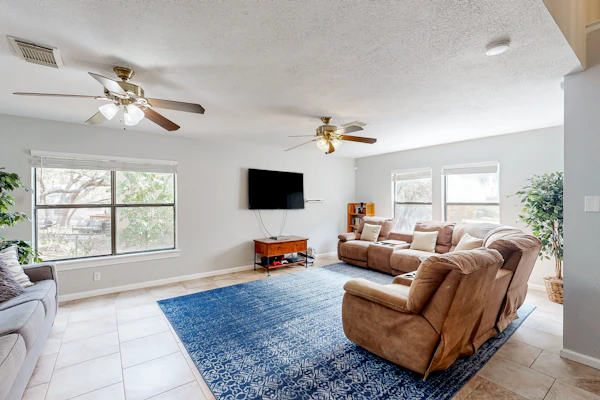 Dog-friendly home with huge yard, covered patio, & fireplace