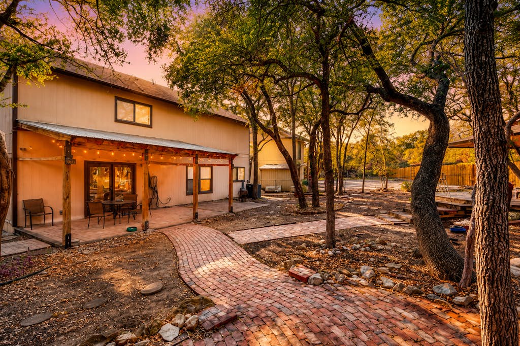 Dog-friendly home with huge yard, covered patio, & fireplace
