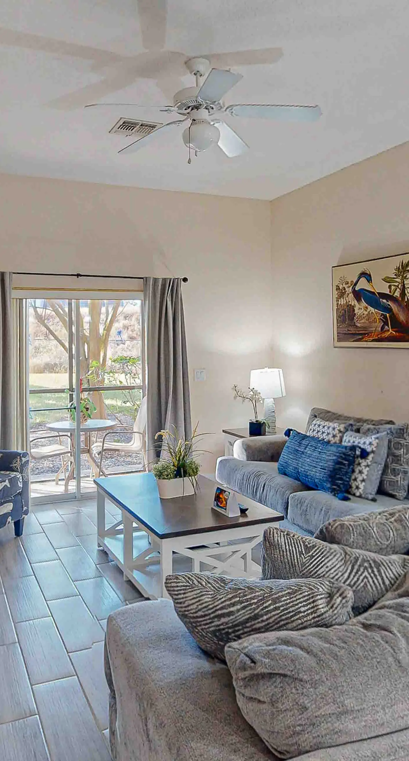 First-floor condo with tennis court, patio, basketball court, sauna, & pools