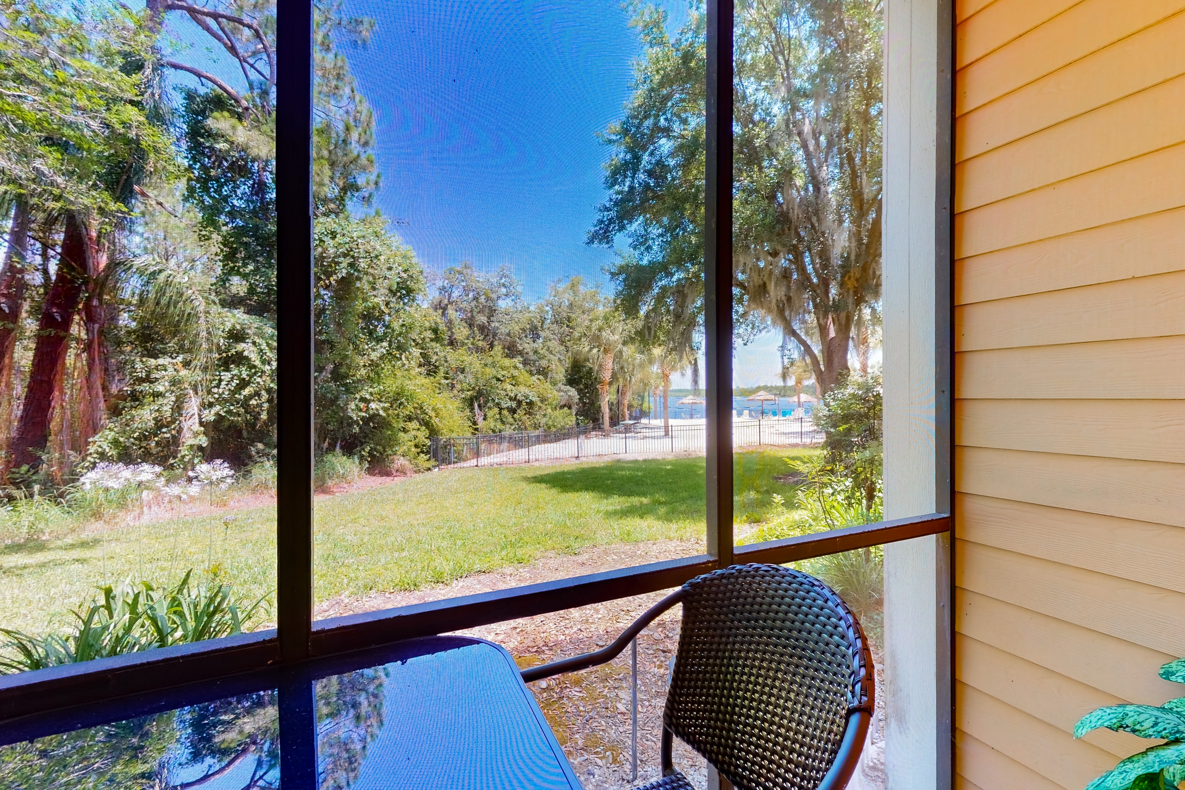 1st floor lake view condo with tennis, basketball court, pools, near theme parks