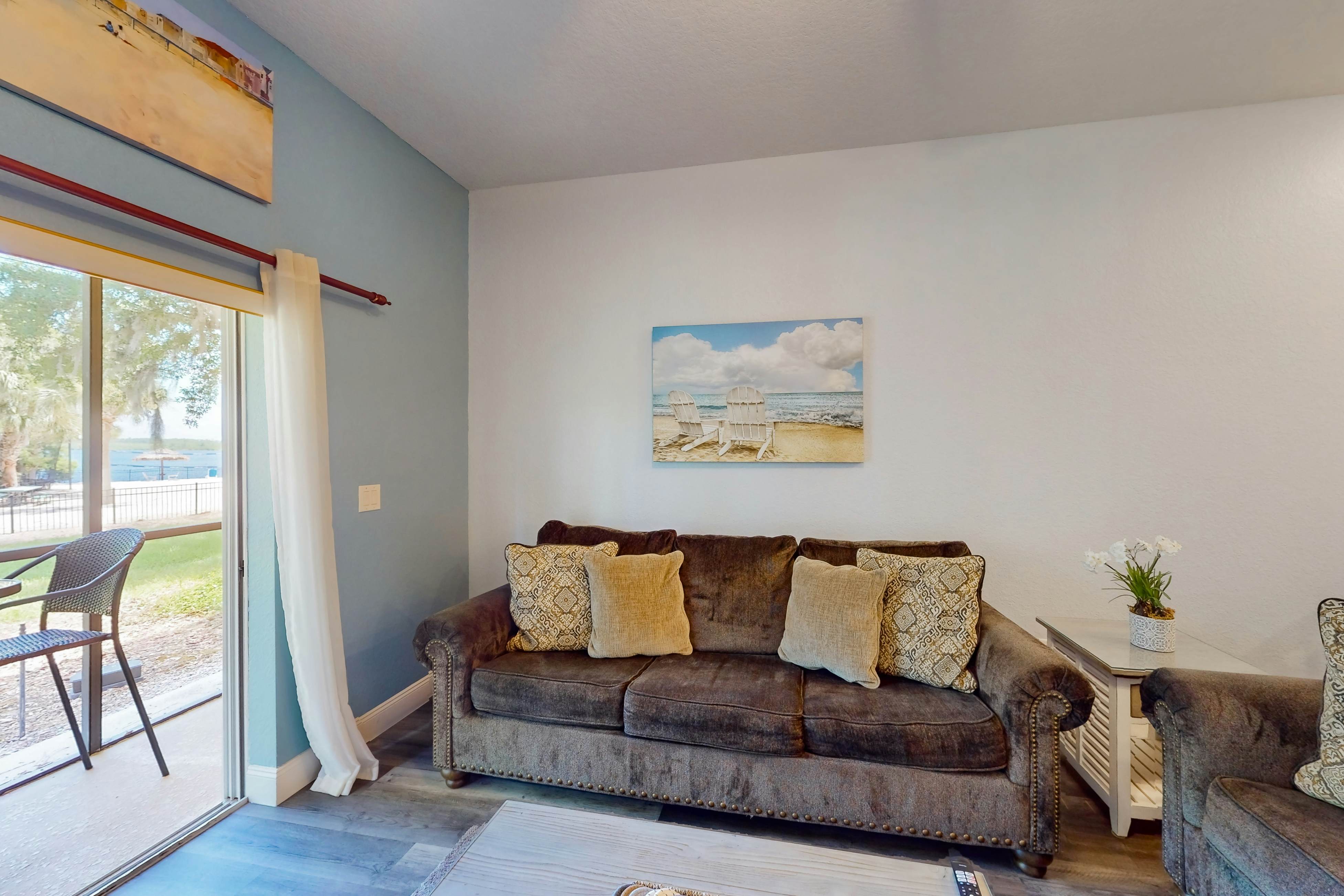 1st floor lake view condo with tennis, basketball court, pools, near theme parks