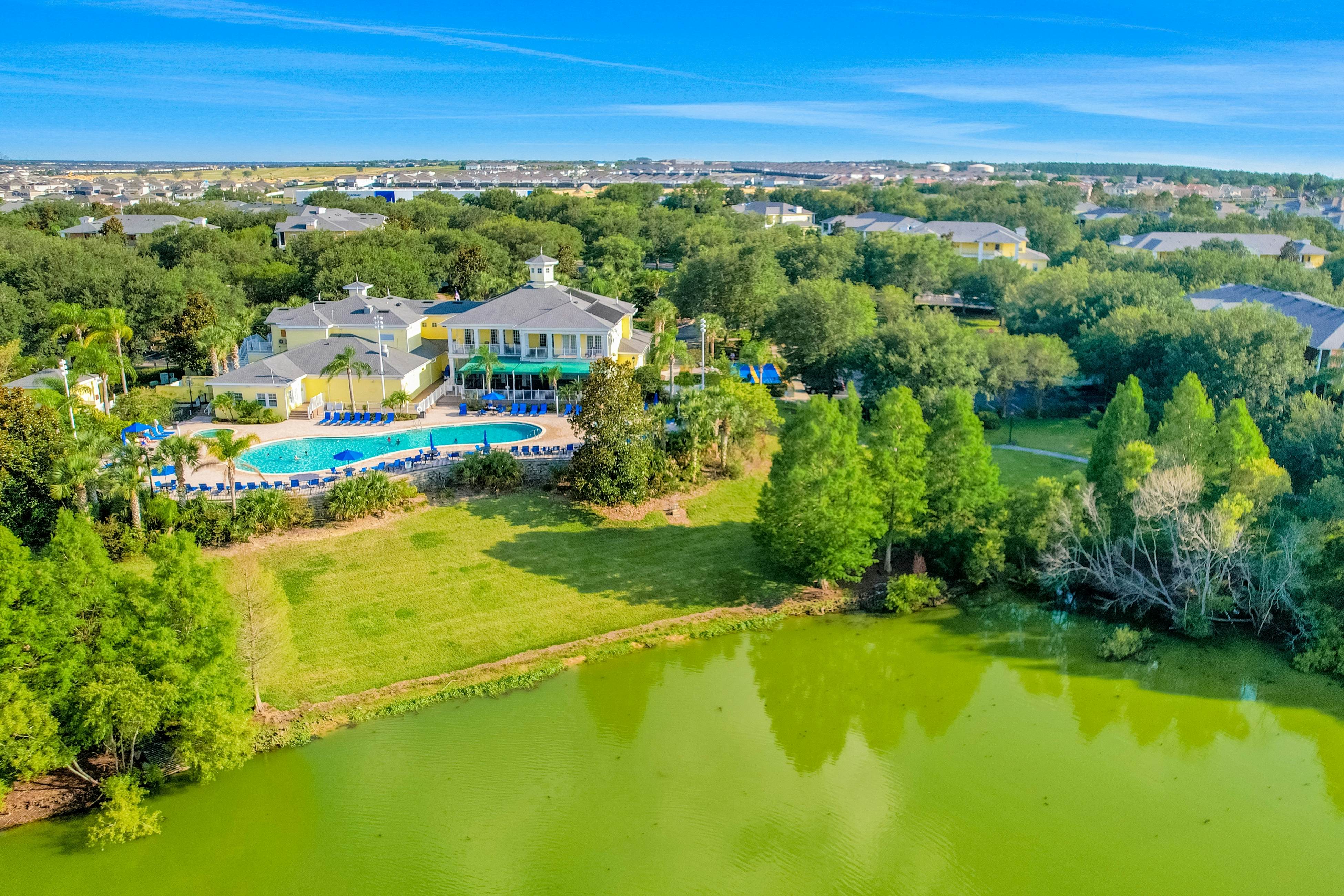 1st floor lake view condo with tennis, basketball court, pools, near theme parks