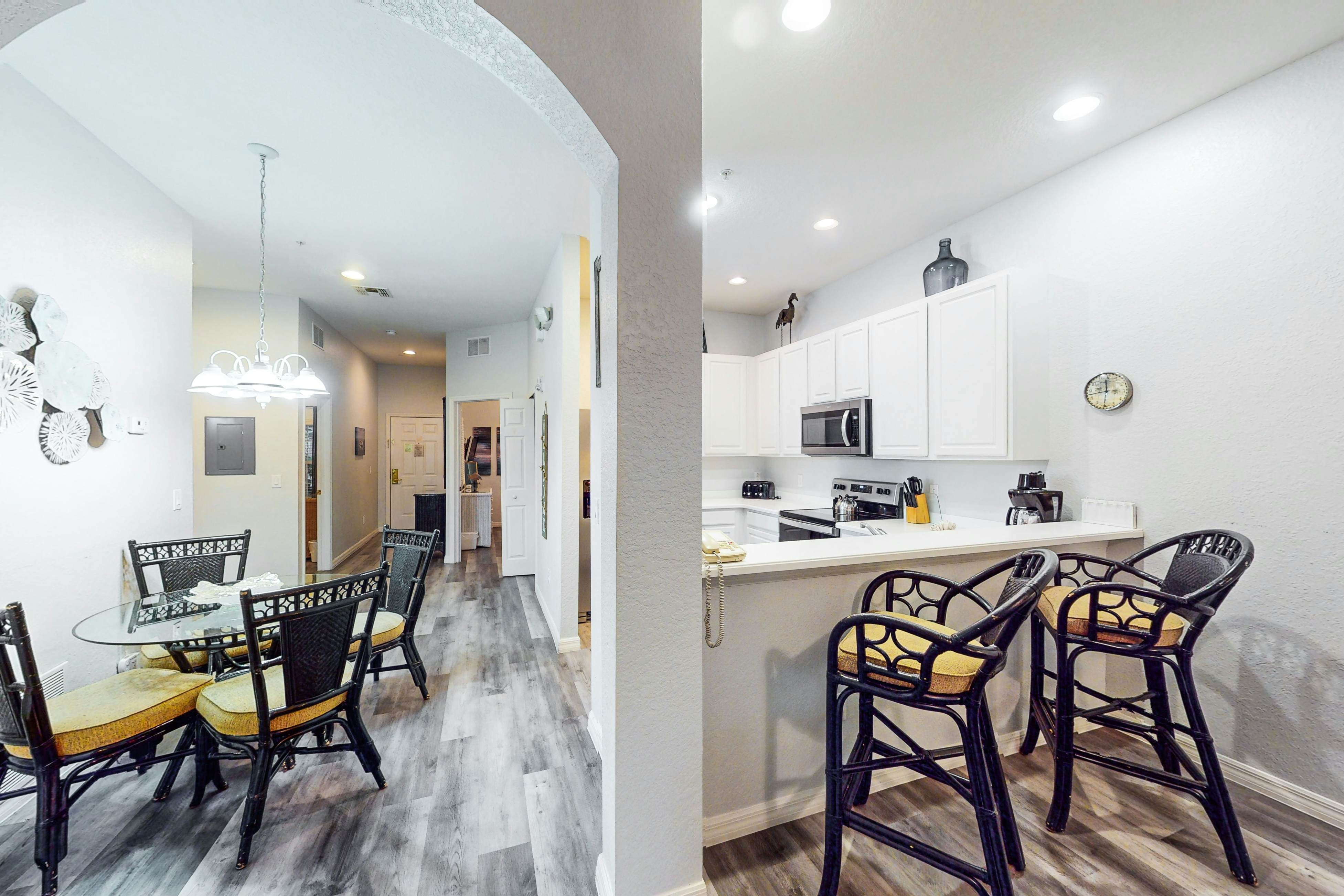 First floor lake view condo w/ pool & hot tub access, private W/D, & central AC