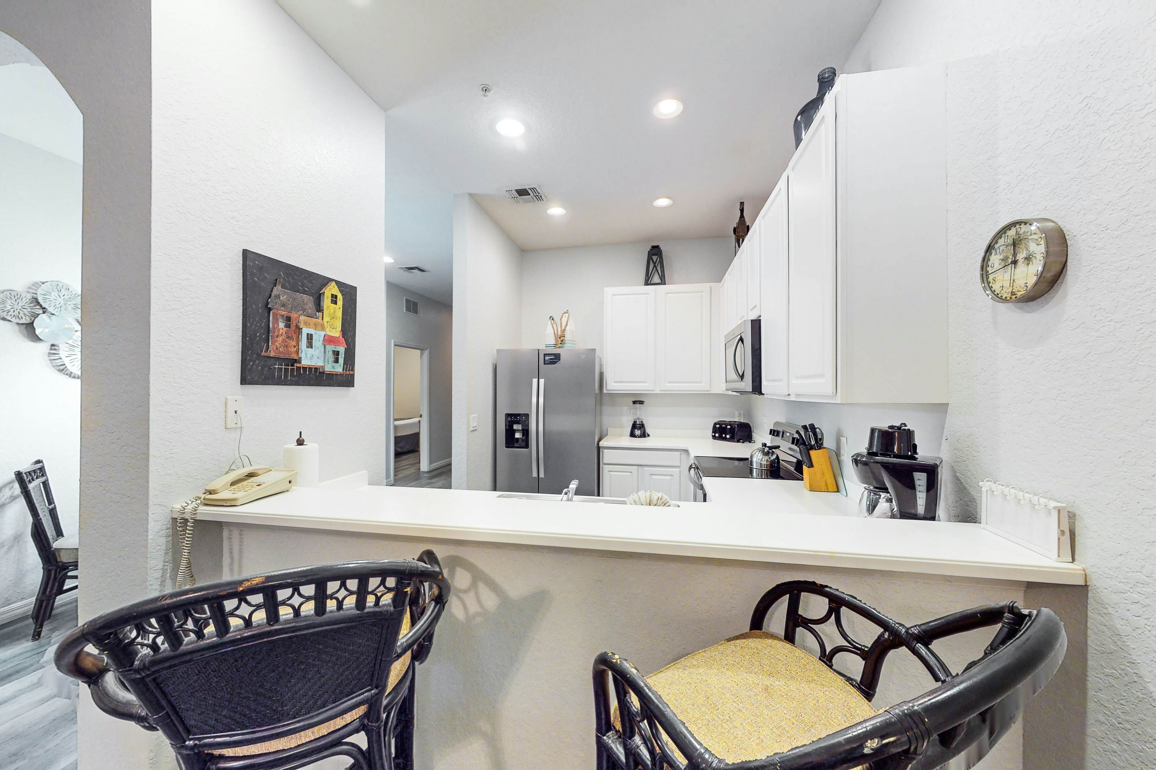 First floor lake view condo w/ pool & hot tub access, private W/D, & central AC