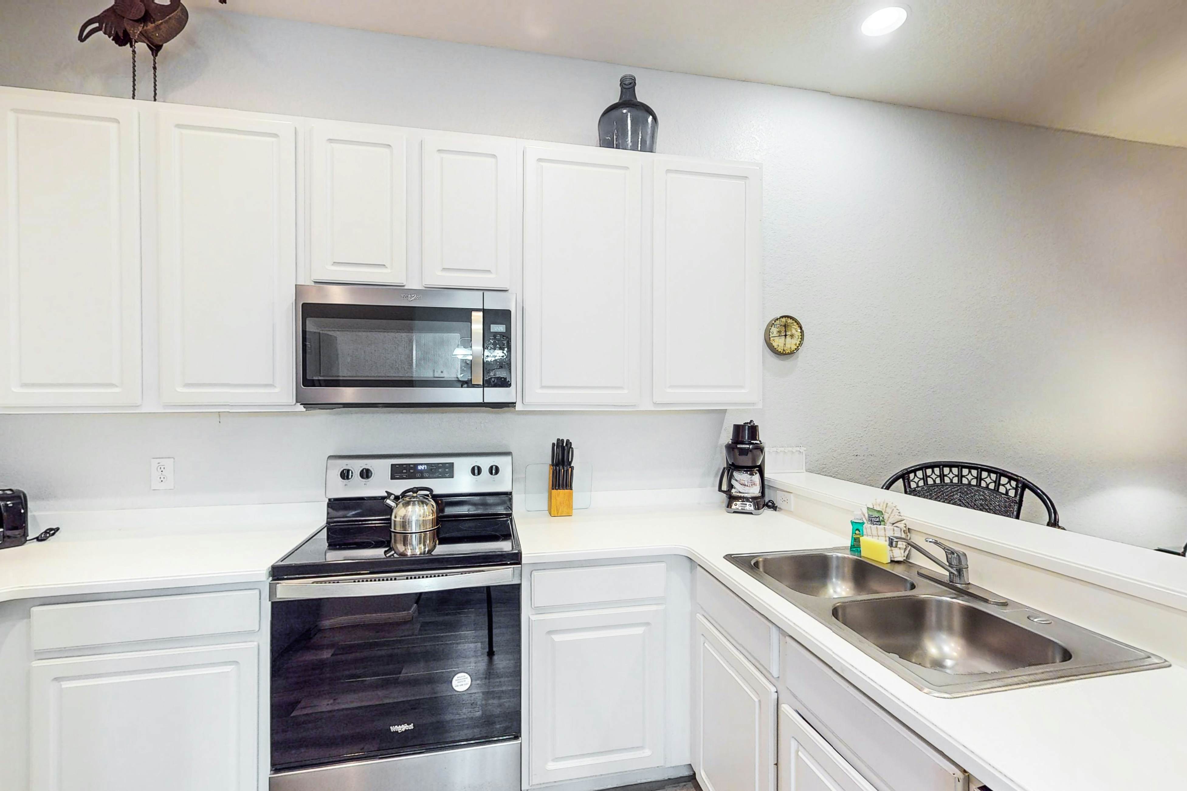 First floor lake view condo w/ pool & hot tub access, private W/D, & central AC