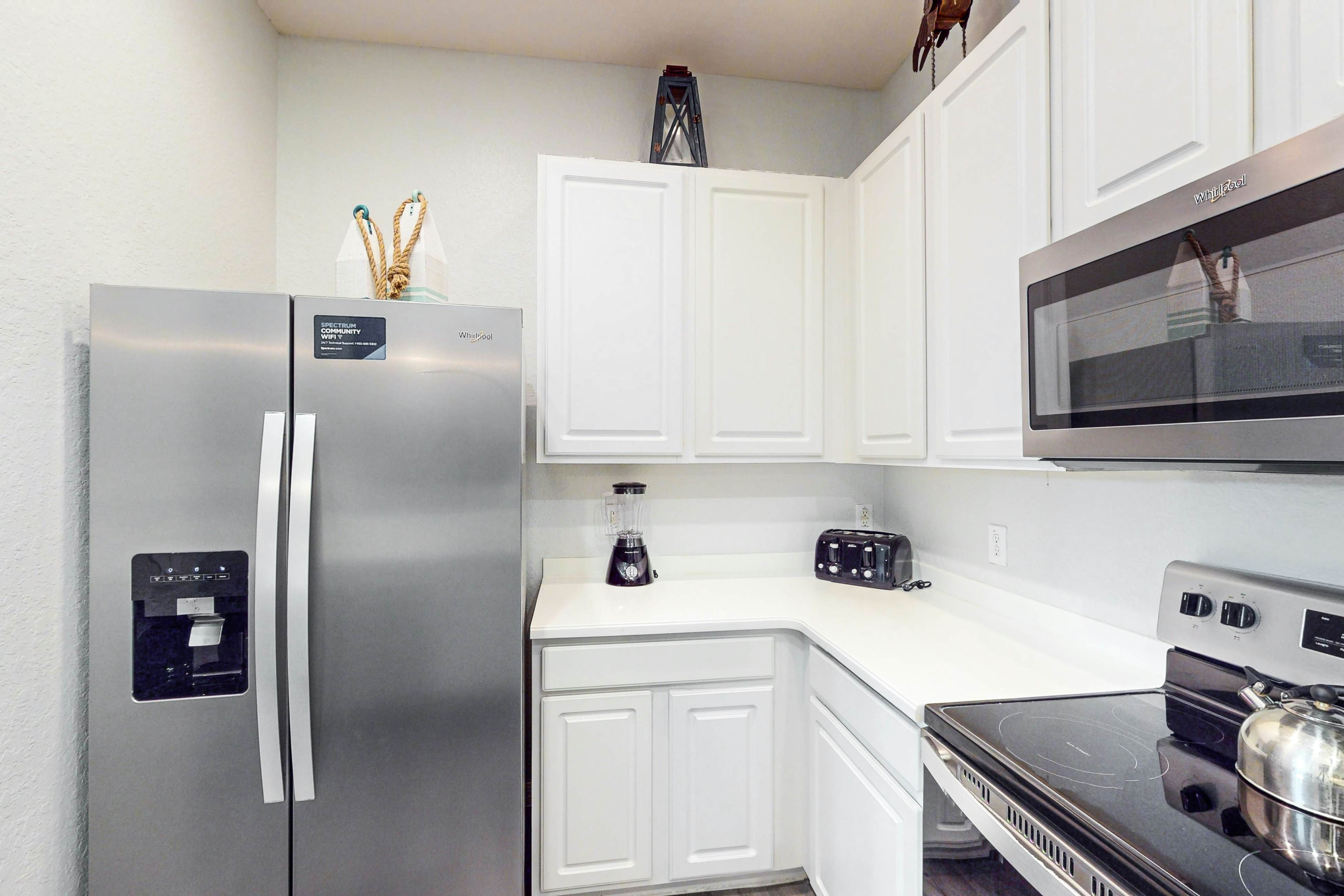 First floor lake view condo w/ pool & hot tub access, private W/D, & central AC