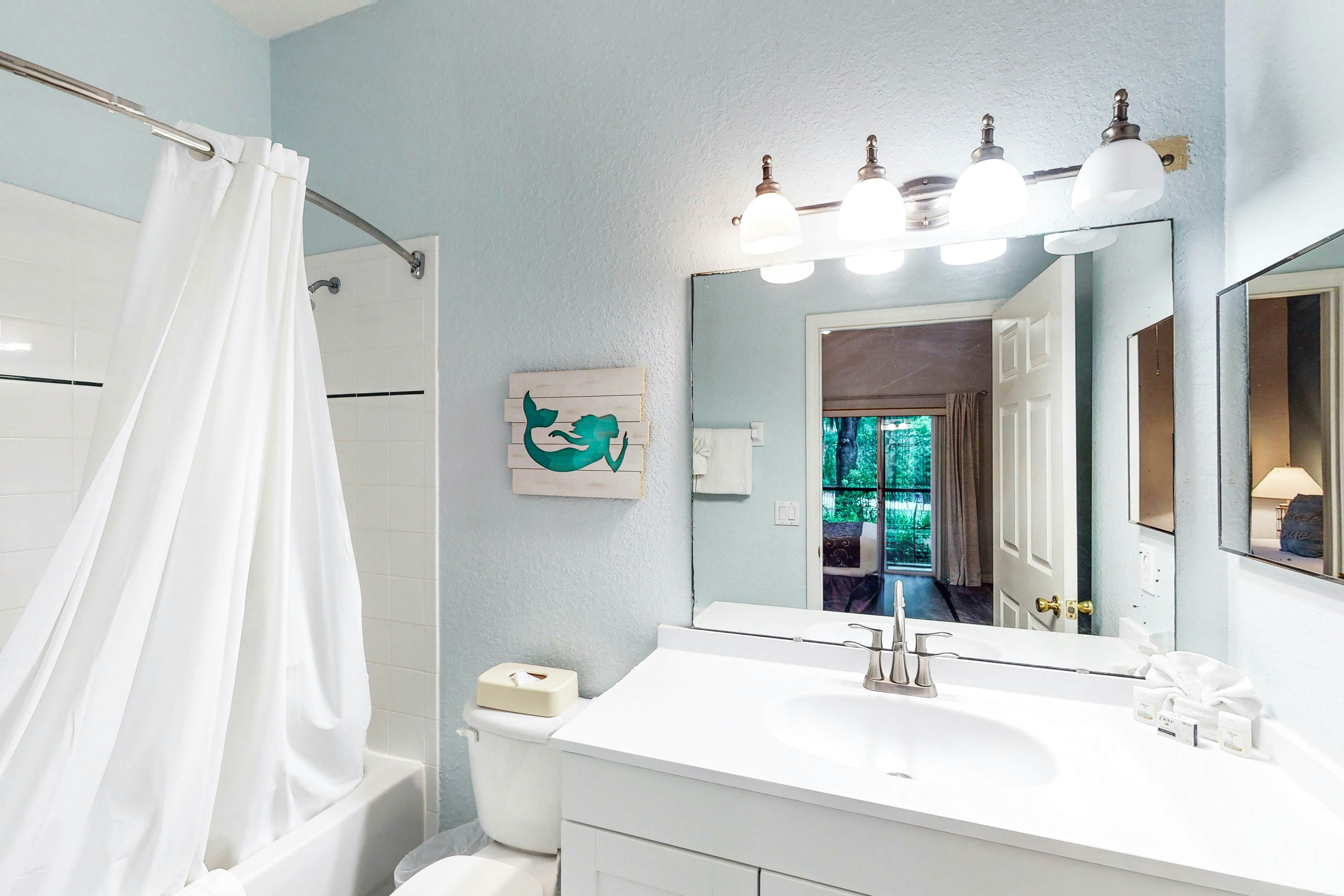 First floor lake view condo w/ pool & hot tub access, private W/D, & central AC