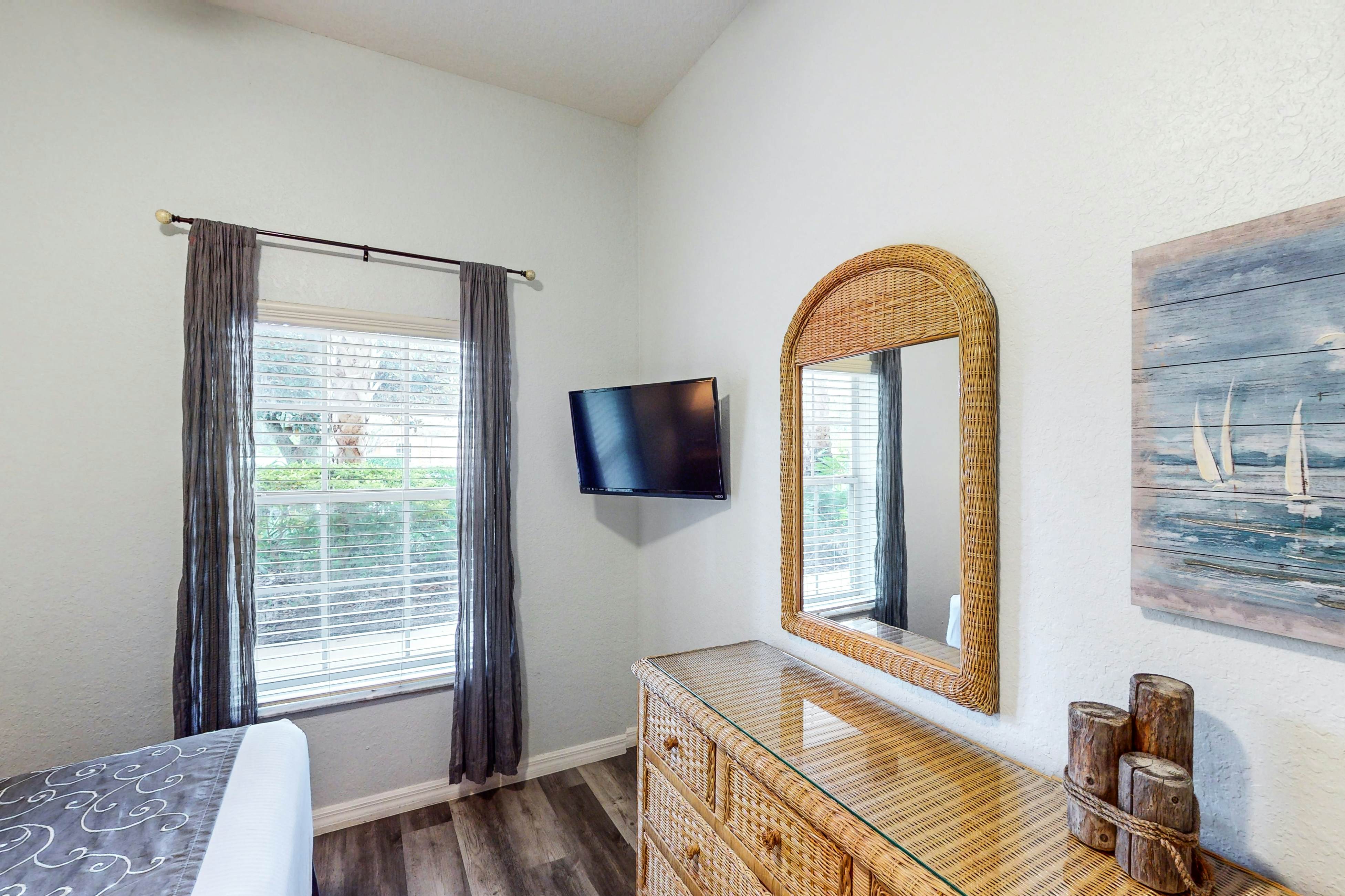 First floor lake view condo w/ pool & hot tub access, private W/D, & central AC