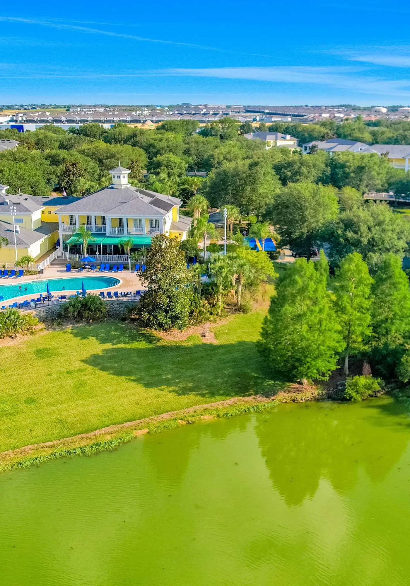 First floor lake view condo w/ pool & hot tub access, private W/D, & central AC