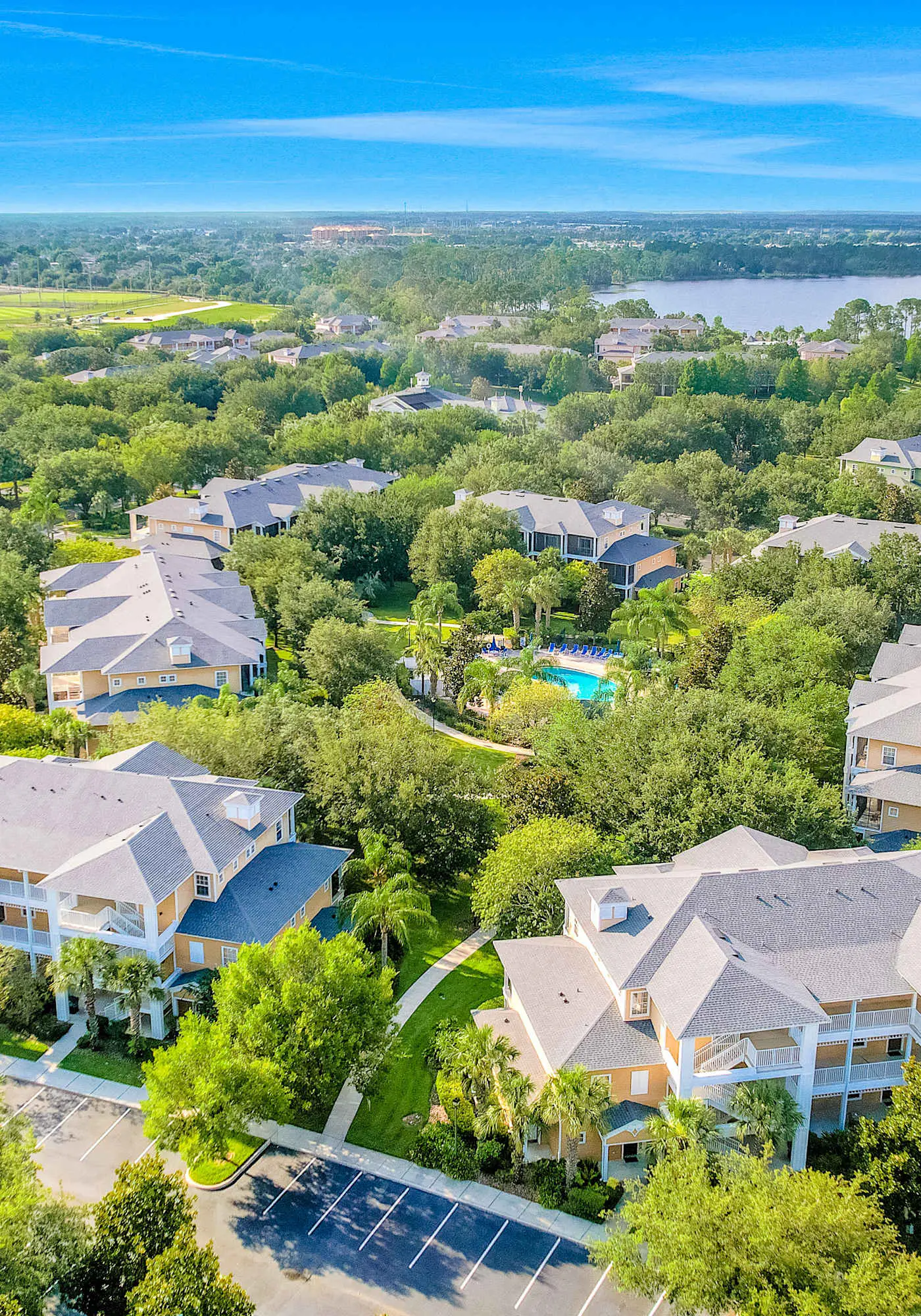 First floor lake view condo w/ pool & hot tub access, private W/D, & central AC